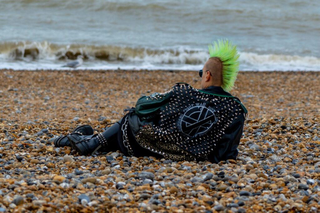 About 13PennyLane - Punk Rockers with green mohawk on beach